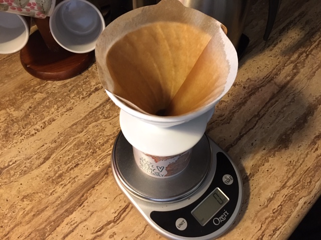 Pourover ready to go. Scale, mug, V60 dripper, prepped filter.